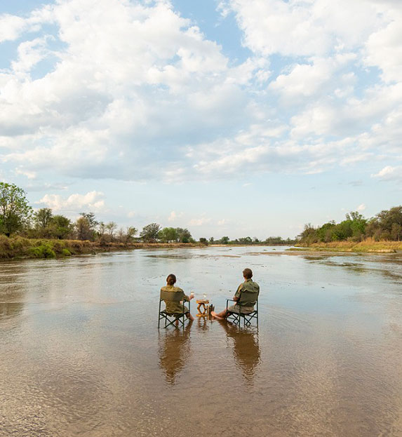 River sundowners at Mwaleshi Camp in Zambia