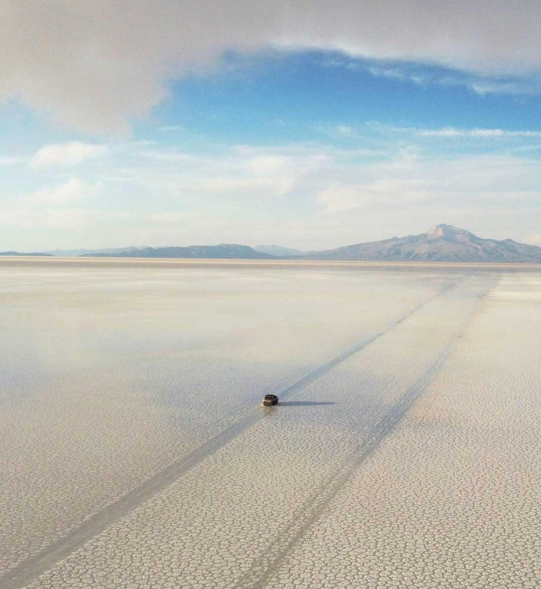 Driving across the Uyini Salt Flats in Bolivia