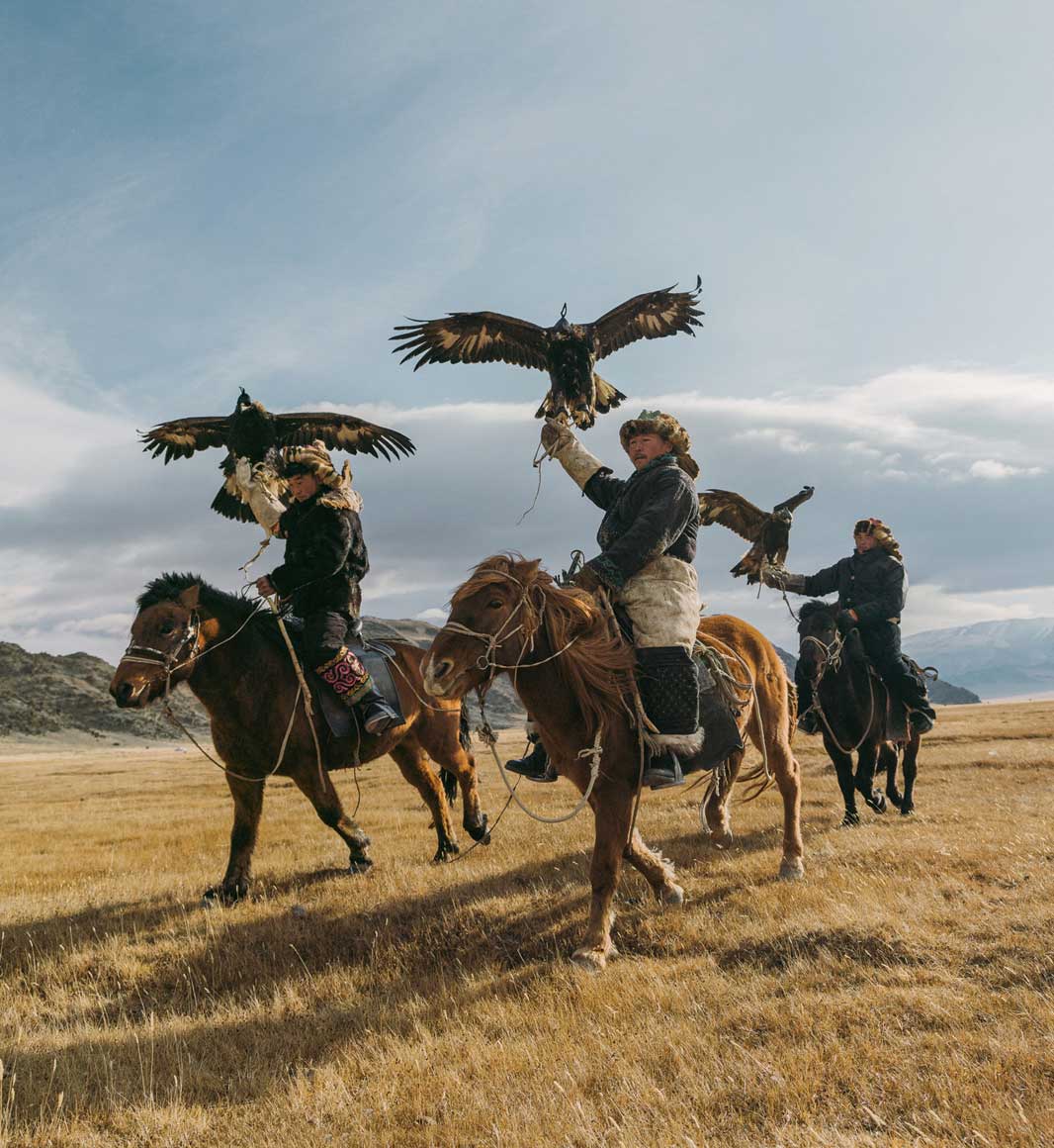 Eagle hunters on horses in Mogolia