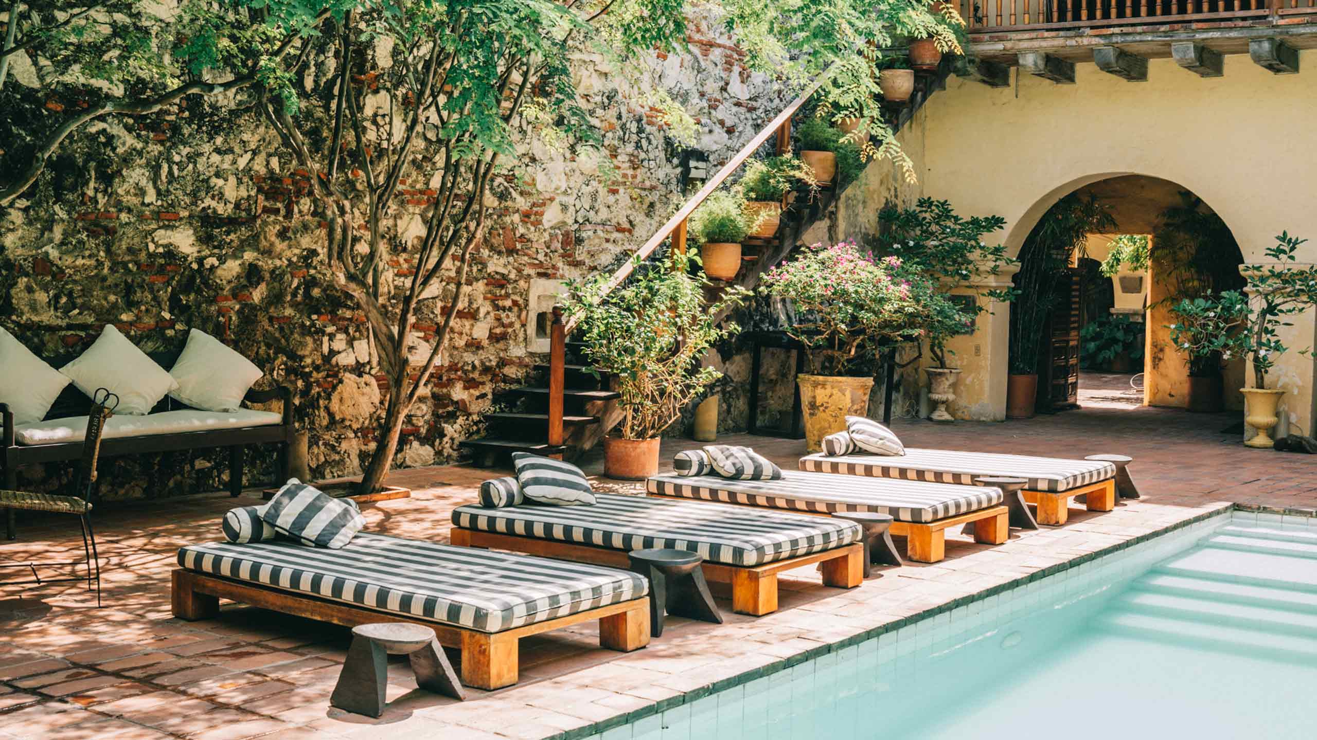 Pool and loungers at Casa Colonial in Cartagena, Colombia