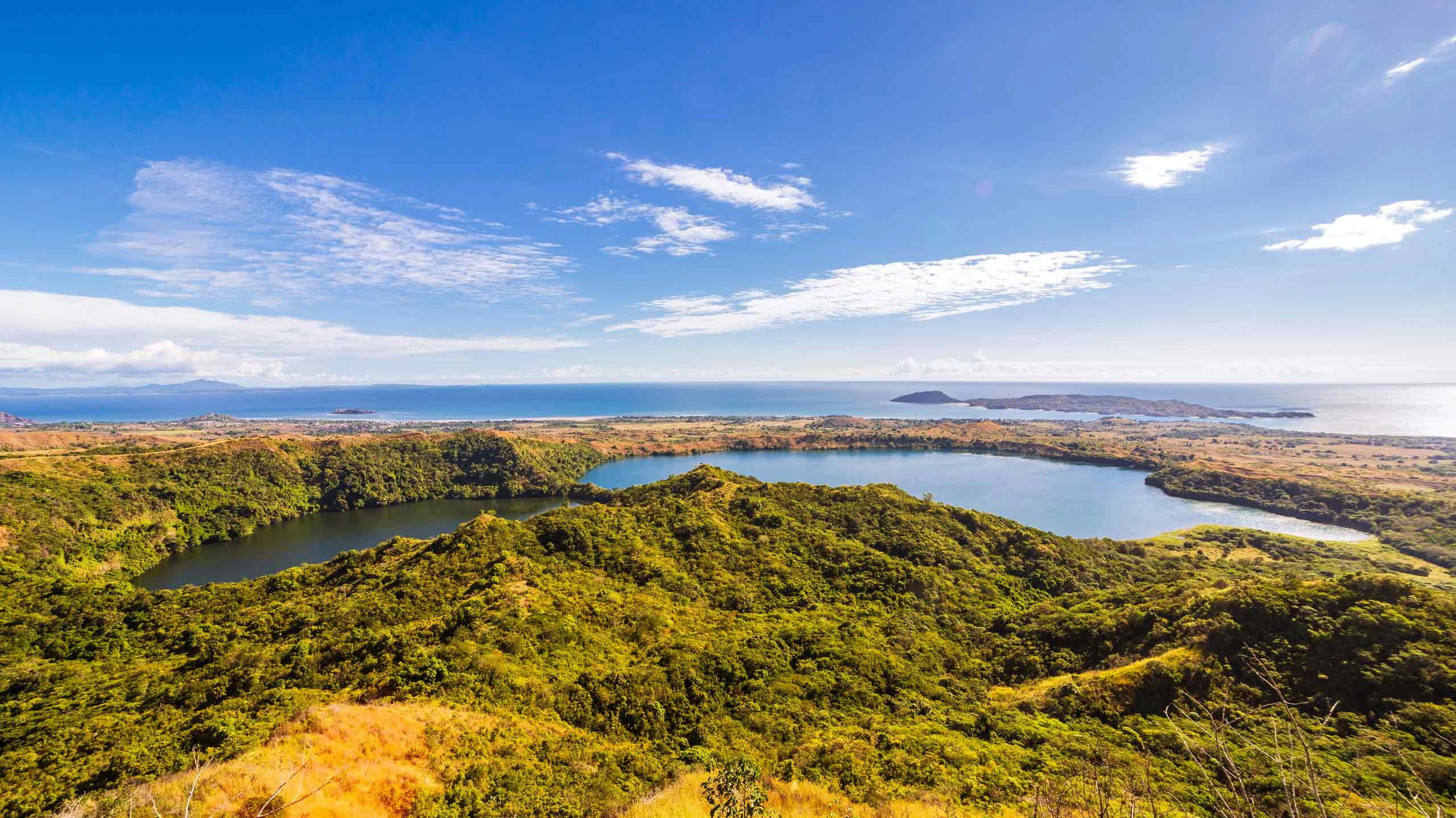 View from Mont Passot above the crater lake Lac Amparihibe and the Indian Ocean, Nosy Be, Madagascar