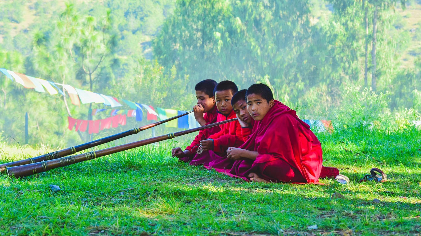 Bhutan monks playing instrument