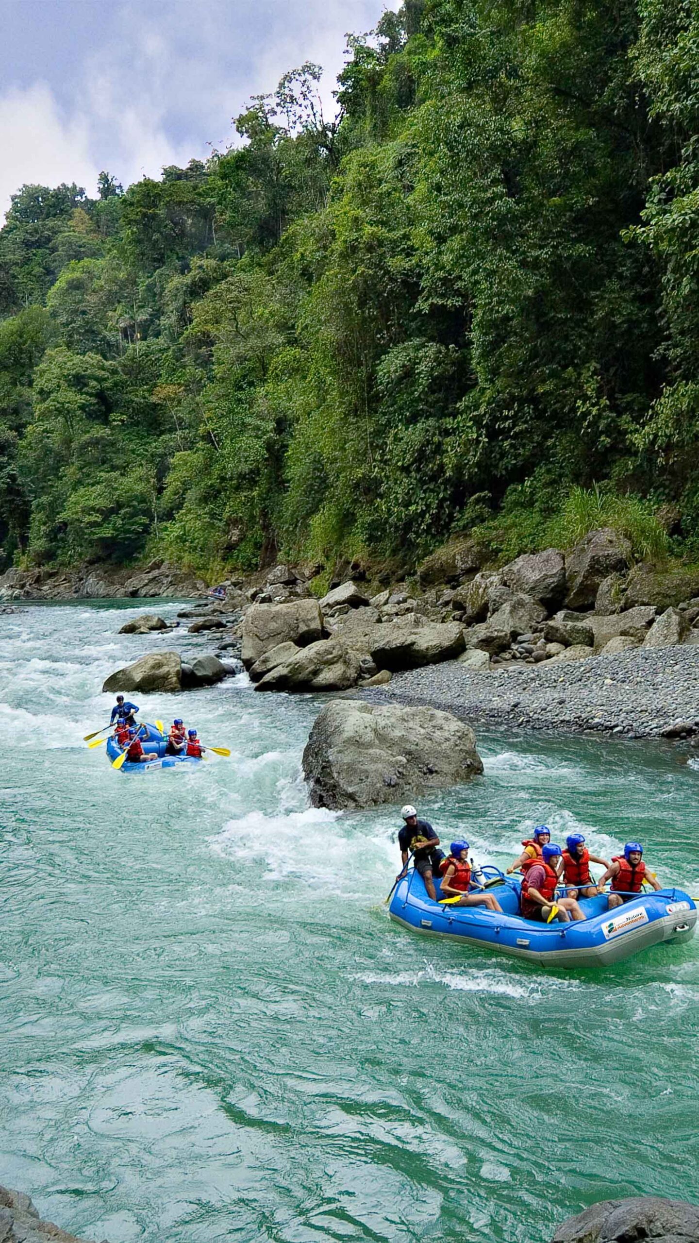 two rafting boats on the pacuare river in costa rica