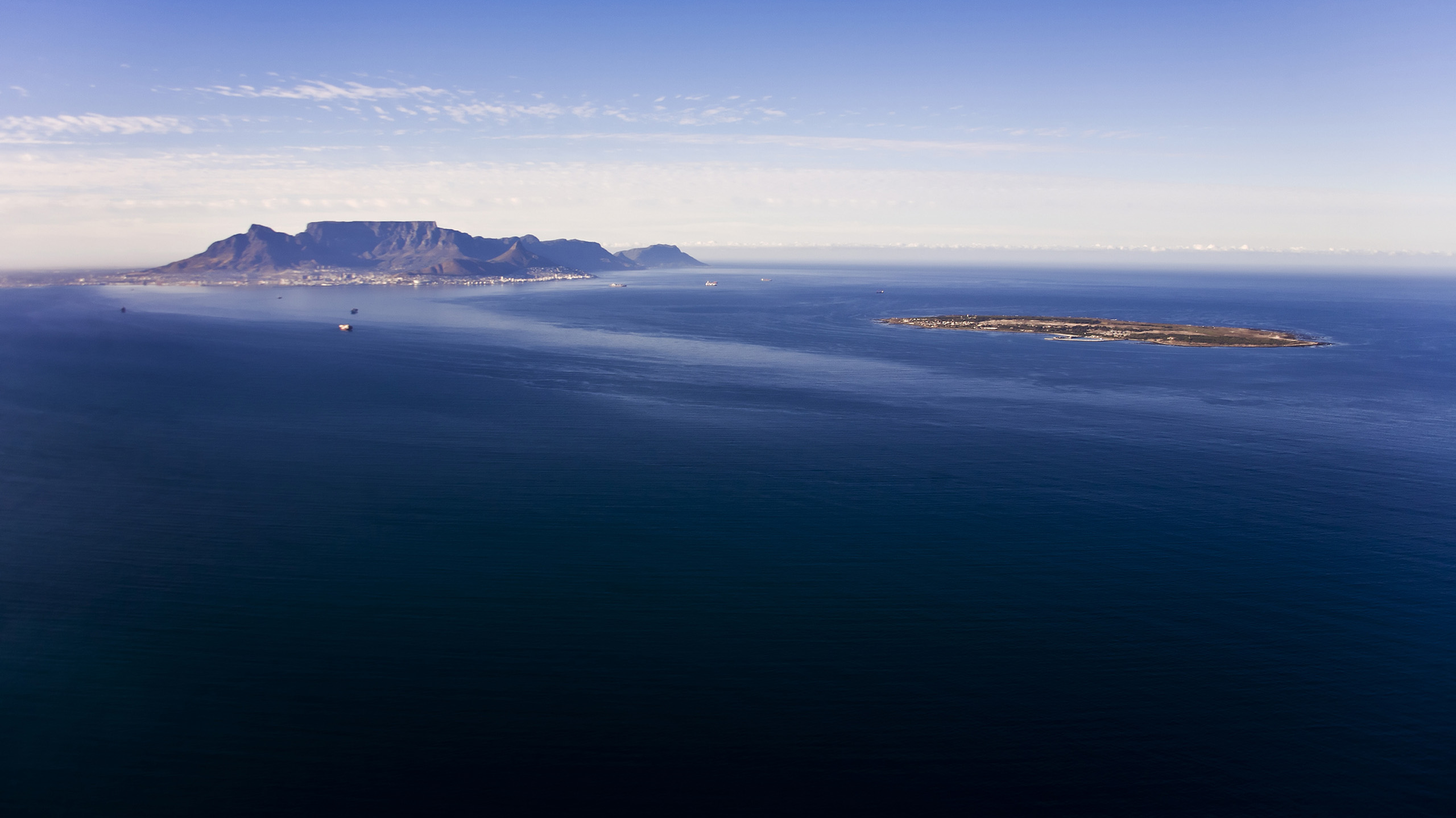 Aerial view of Robben Island with Table Mountain in the distance, Cape Town; South Africa.