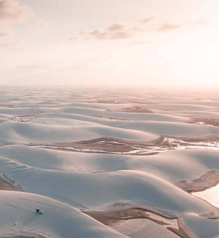 view of lencois maranhenses and jeep in the foreground
