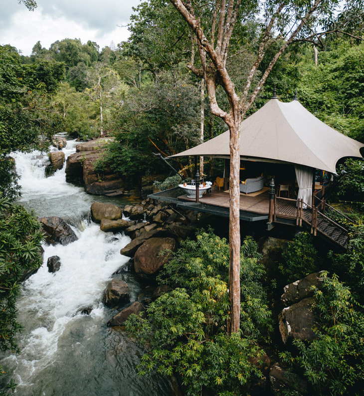 guest tent overlooking the cardamom river at shinta mani wild