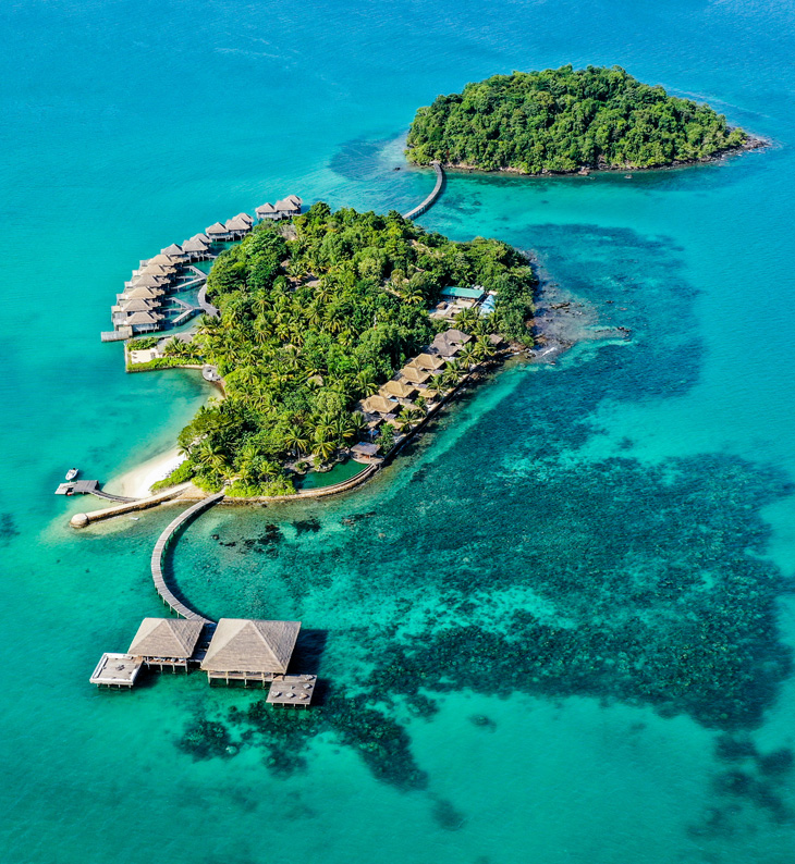 aerial view of the islands and private overwater bungalows for song saa private island