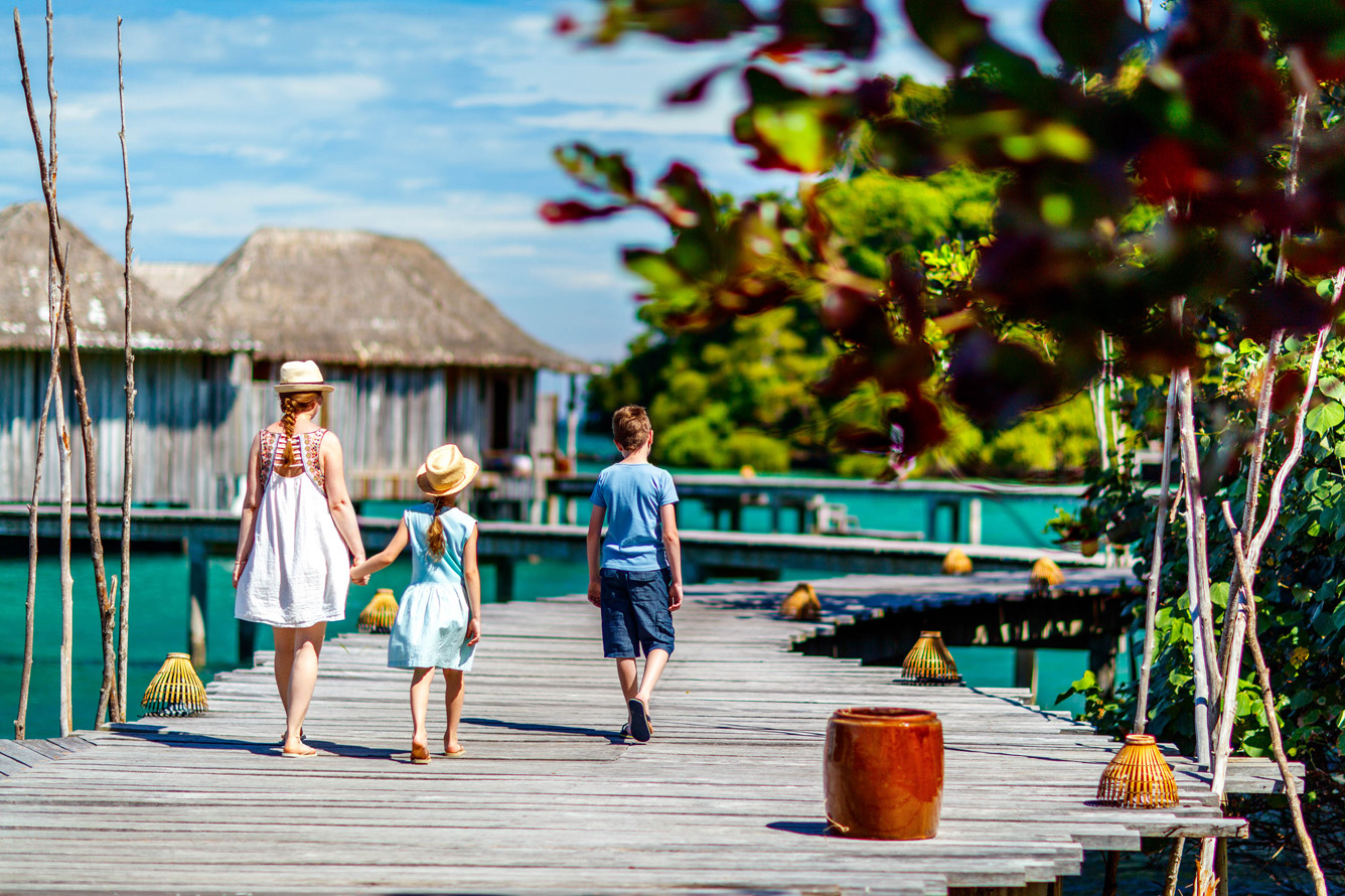 children on the boardwalk at song saa private island cambodia
