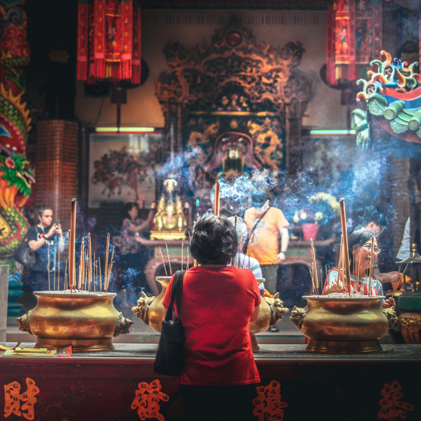 chinese woman in front of a teahouse in china
