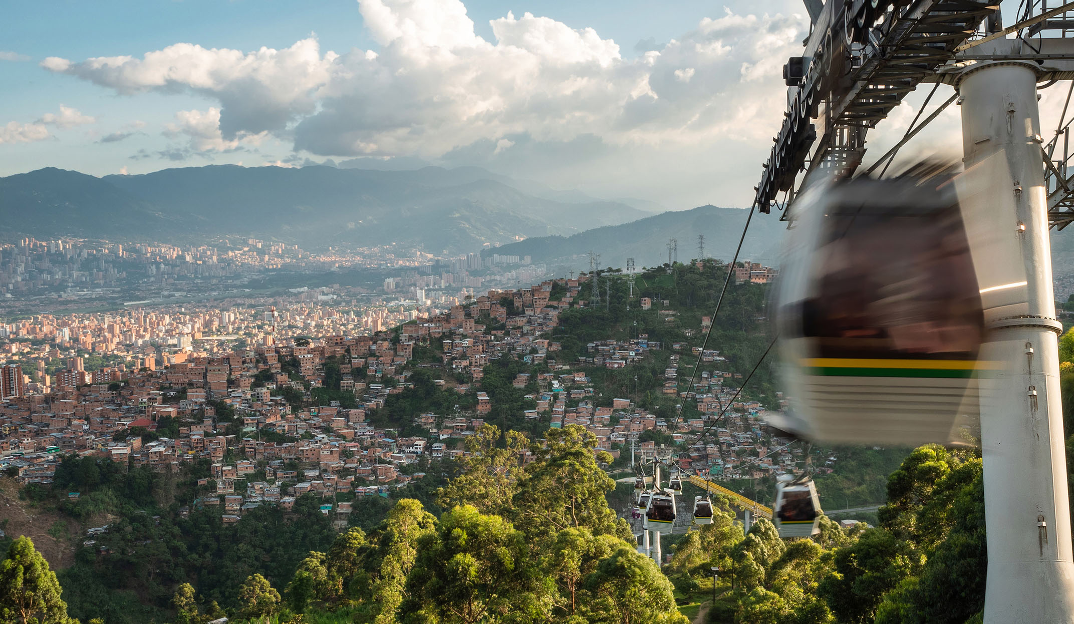 Cable cars traveling over the city of Medellin, Antioquia Department, Colombia.