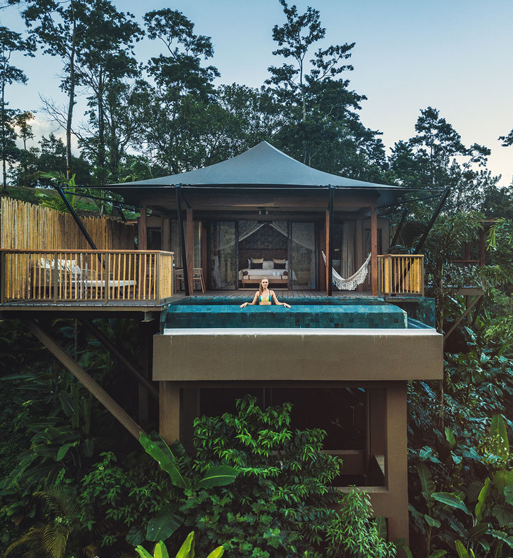 external view of guest chalet at nayara tented camp with guest pool