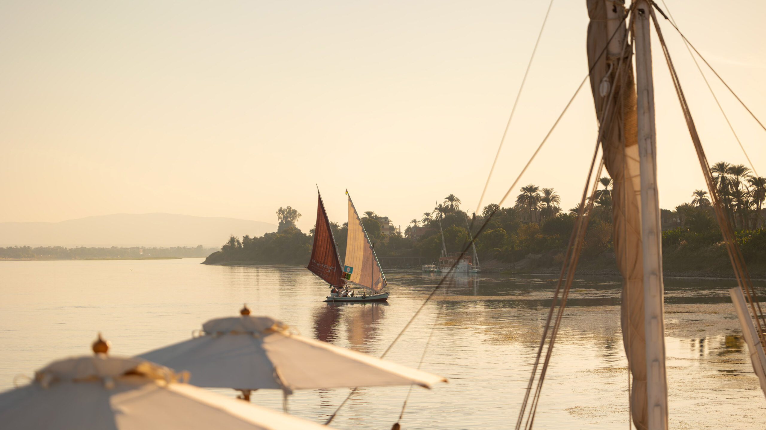 dahabias on the nile at aswan in egypt