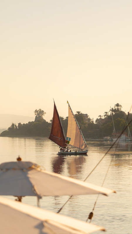 dahabias on the nile at aswan in egypt