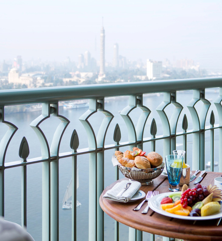 balcony of the four seasons cairo overlooking the nile with fruit on a plate