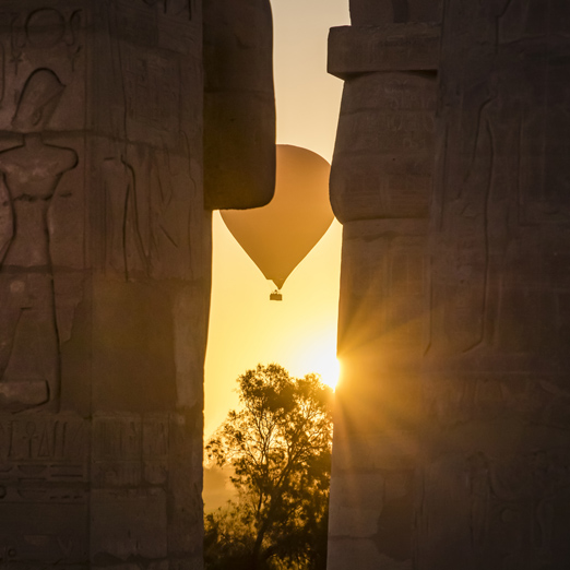 A balloon ride on the west bank of the Nile, seen through the features of the Ramesseum is the memorial temple of Pharaoh Ramesses II, Luxor, Egypt