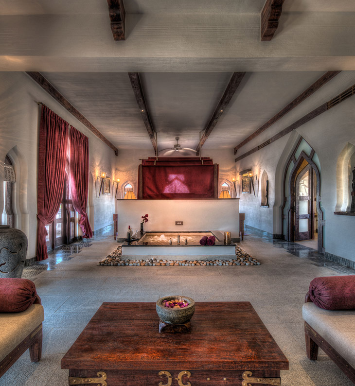 bedroom of zanana room at evolveback kamalapura palace in hampi