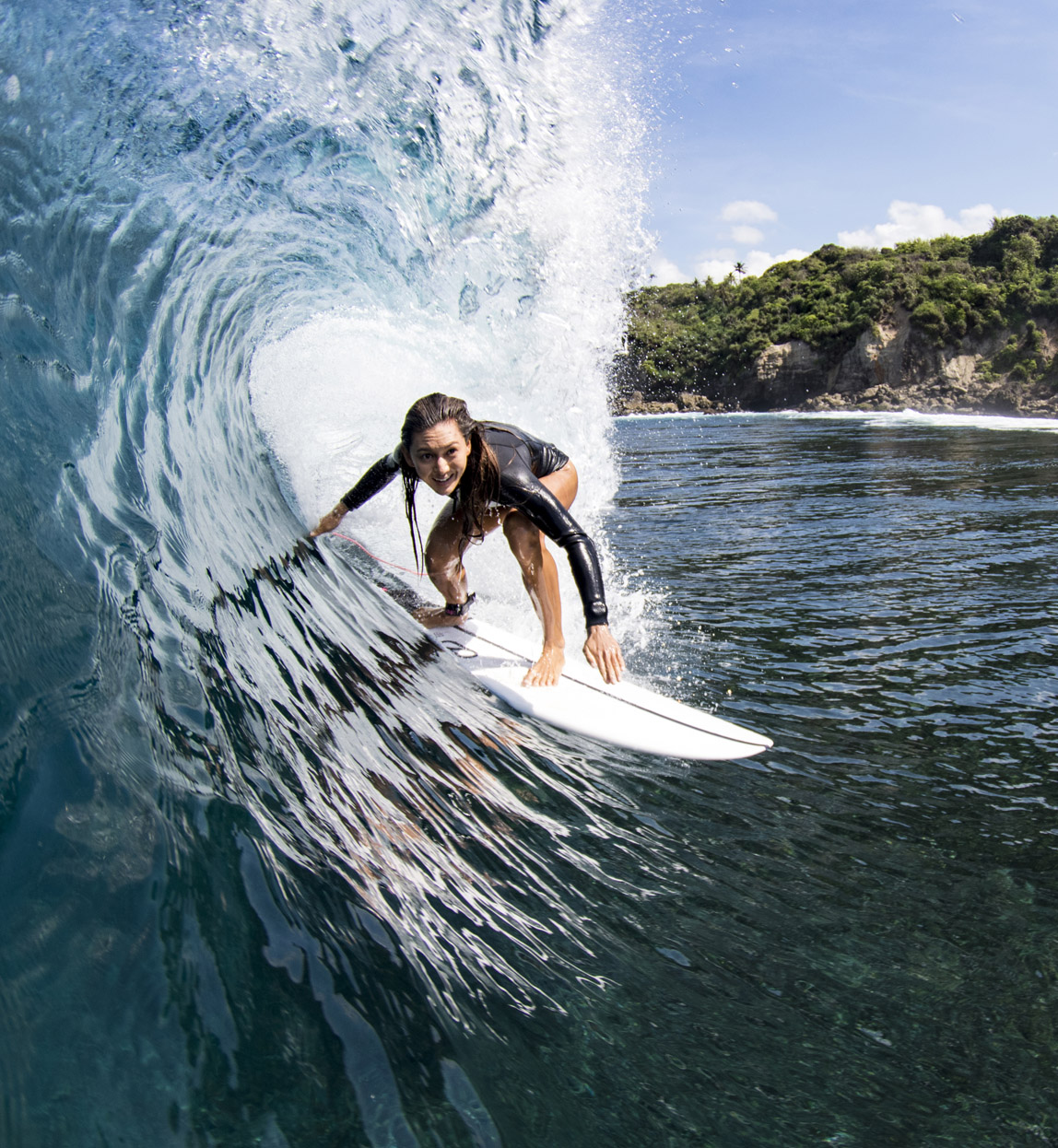 woman surfing at beach resort in indonesia