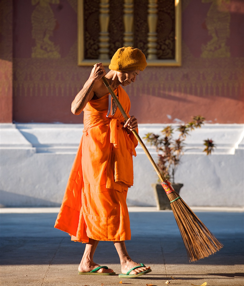 monk on the street in luang prabang