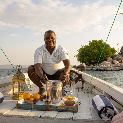 sundowners on a boat on lake malawi at kaya mawa