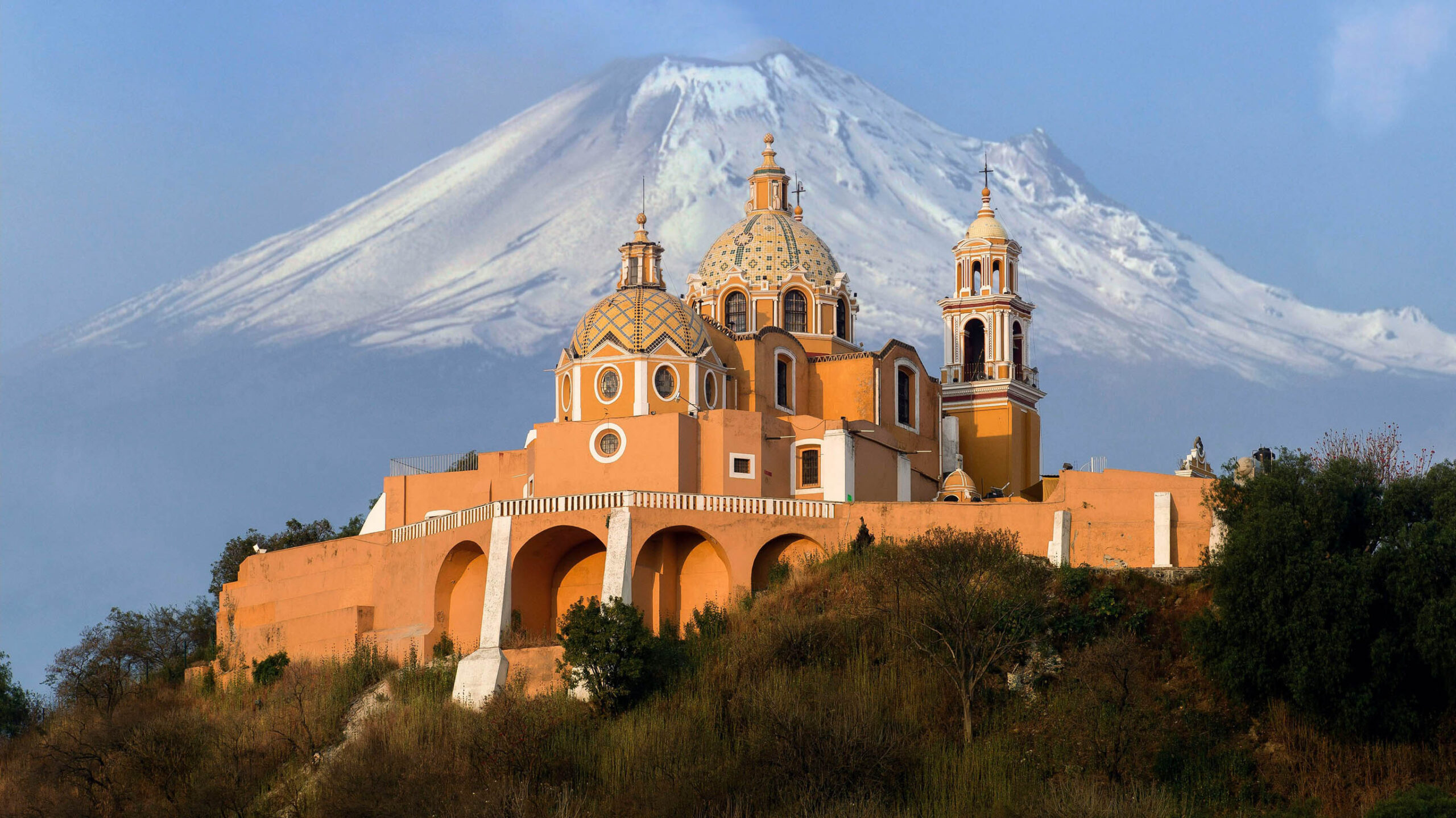 popocatepetl volcano and church on a hill in mexico