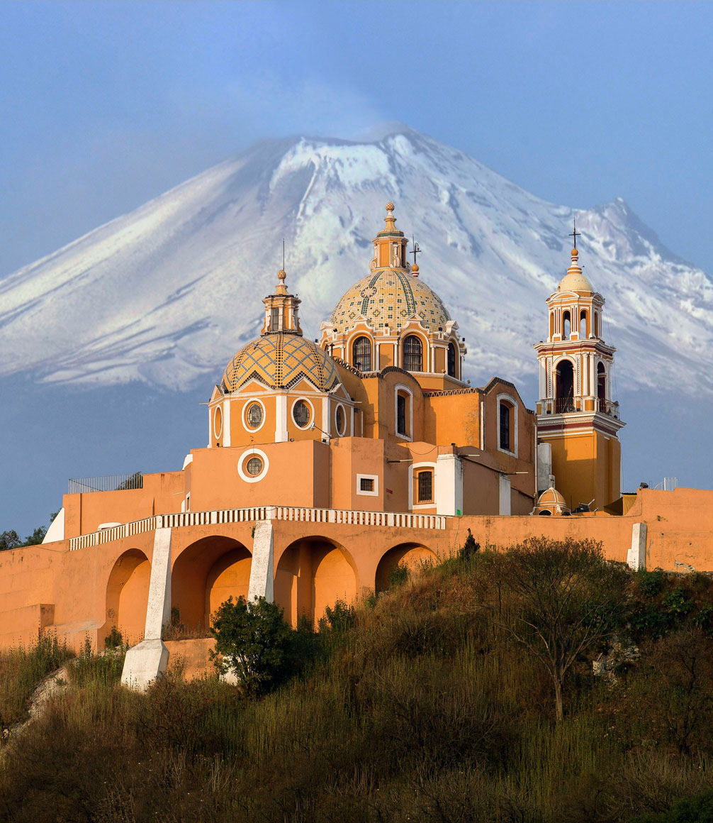 popocatepetl volcano and church on a hill in mexico