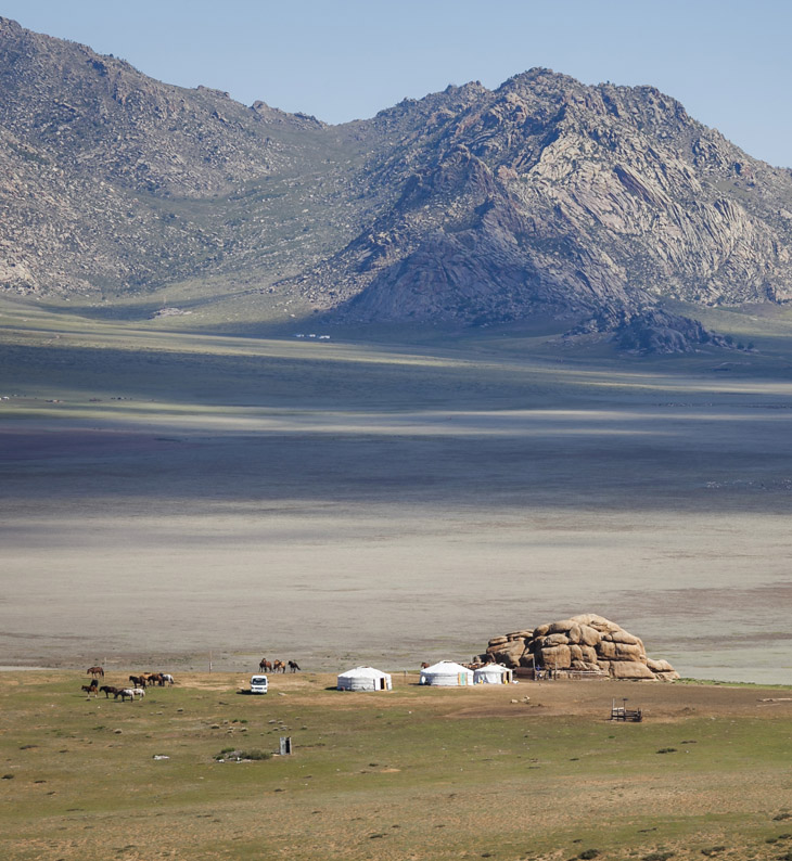 altai mountains in mongolia's heartlands with yurts in foreground
