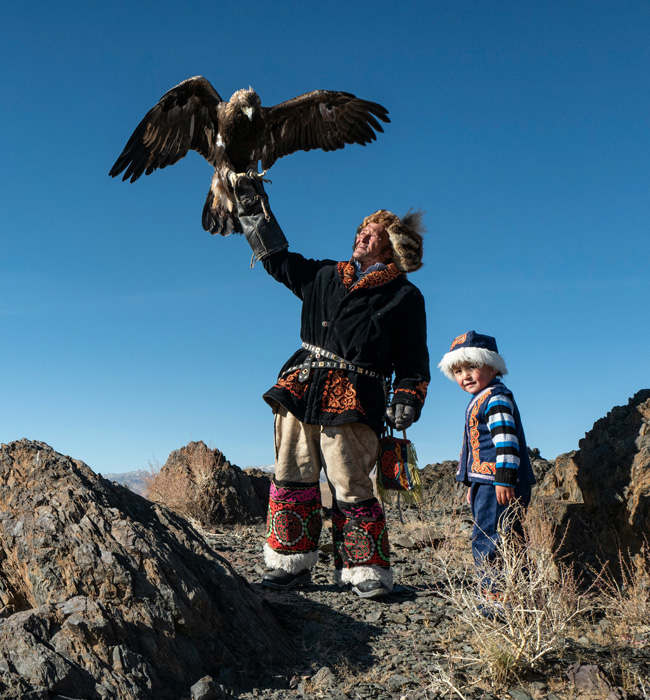 mongolia eagle hunters with their eagles