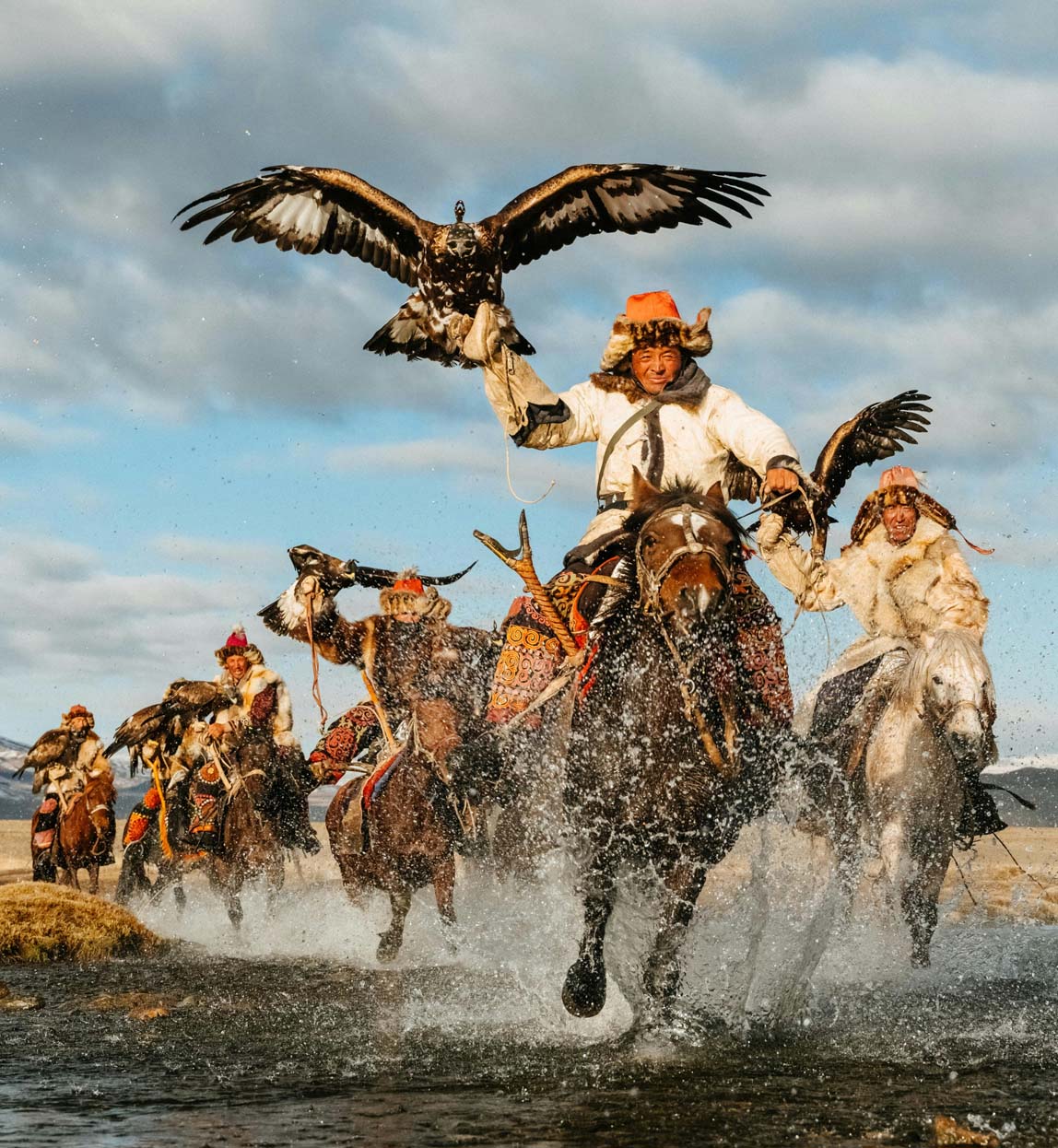 mongolia's eagle hunters riding on horseback