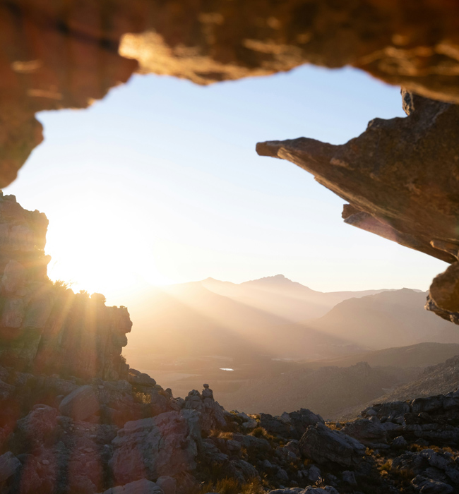 sun shining through rock formation in a cave in south afrcia
