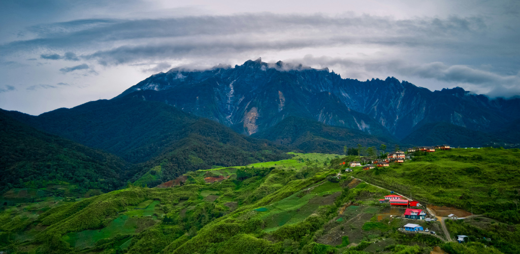 view of mount kinabalu in borneo with highlands in foreground