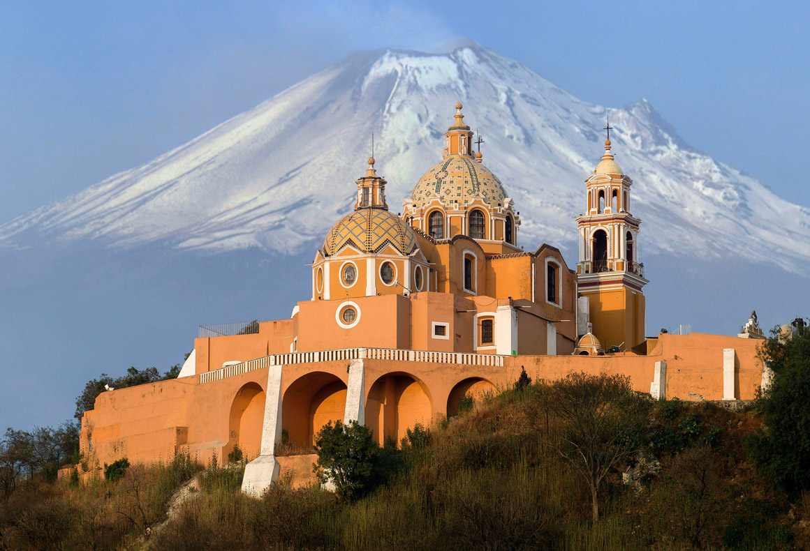 popocatepetl volcano and church in foreground