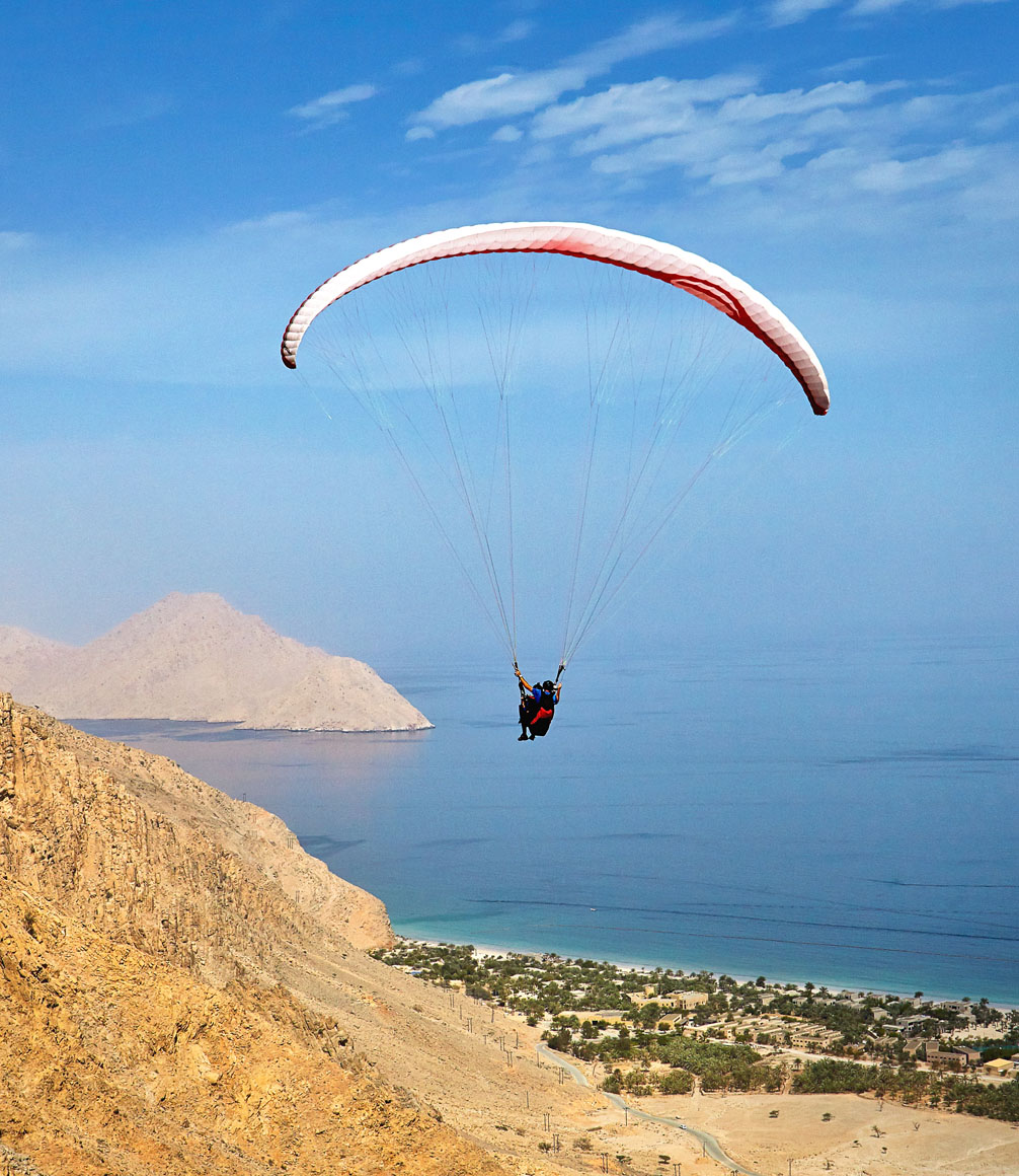 paragliding into zighy bay oman