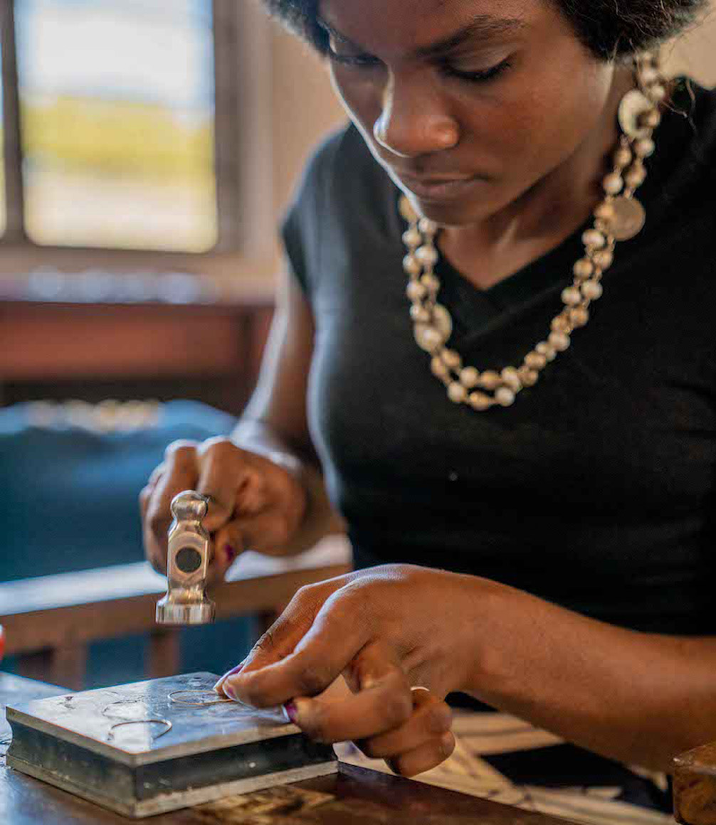 zambian woman creating jewellery at mulberry mongoose