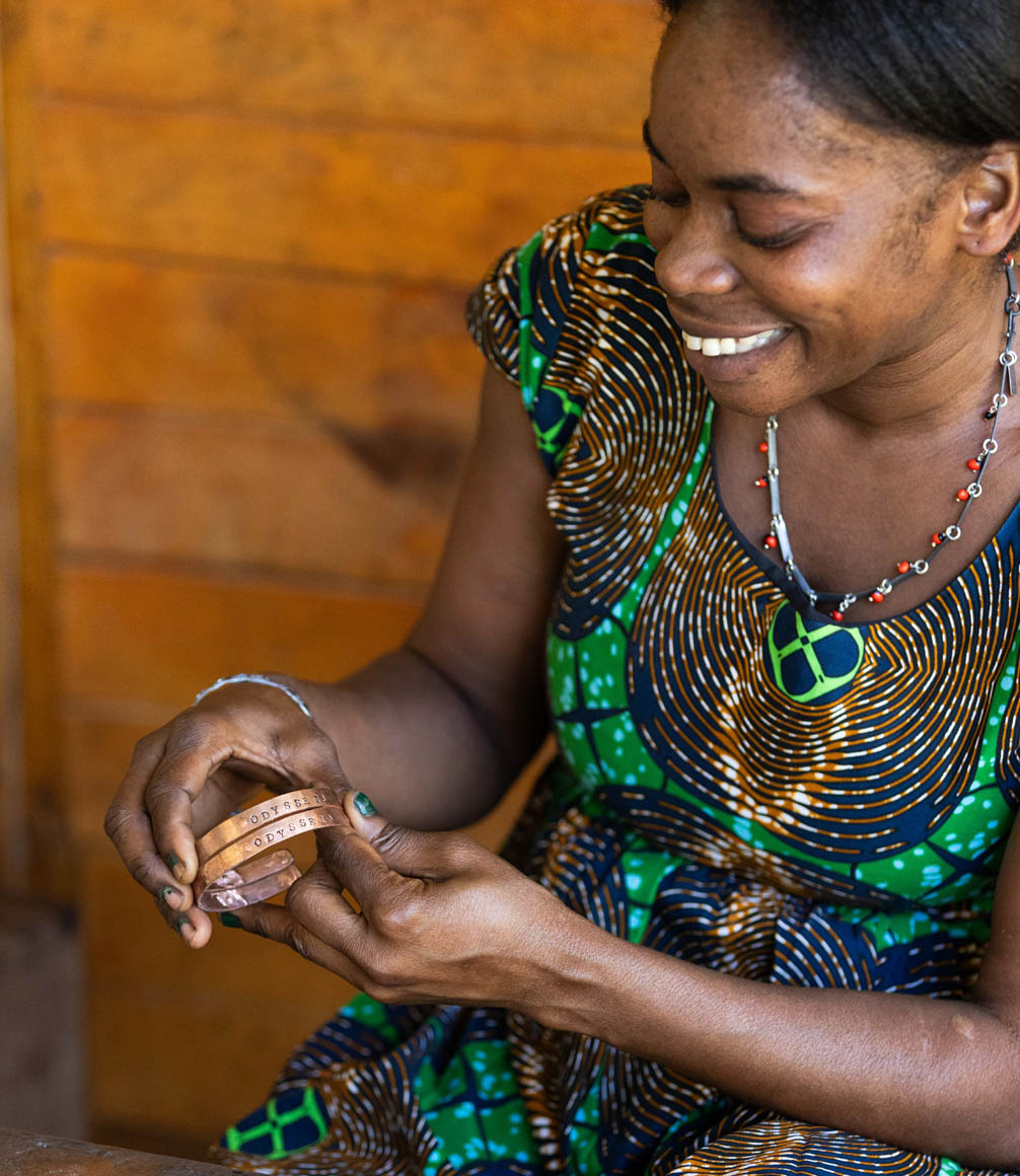 zambian woman creating jewellery at mulberry mongoose