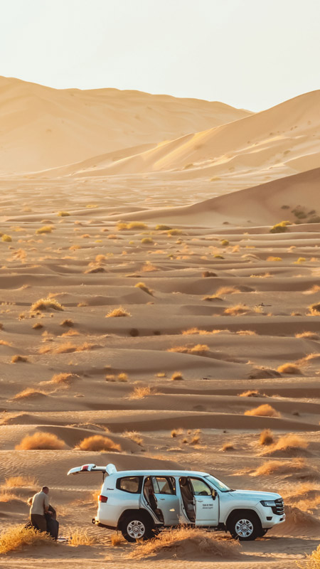 4x4 parked in the desert of the empty quarter in oman on a luxury desert expedition holiday