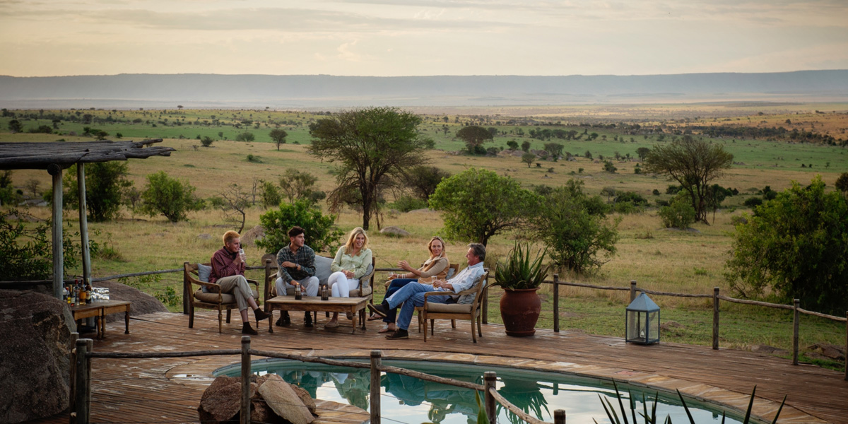 family on the verandah at Mkombes house in tanzania on their luxury family safari