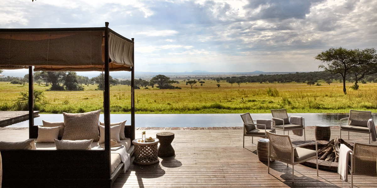 view of plains and pool from singita serengeti house in tanzania