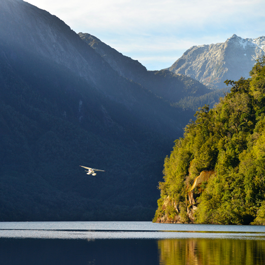 seaplane flying through the pumalin fjords in chile