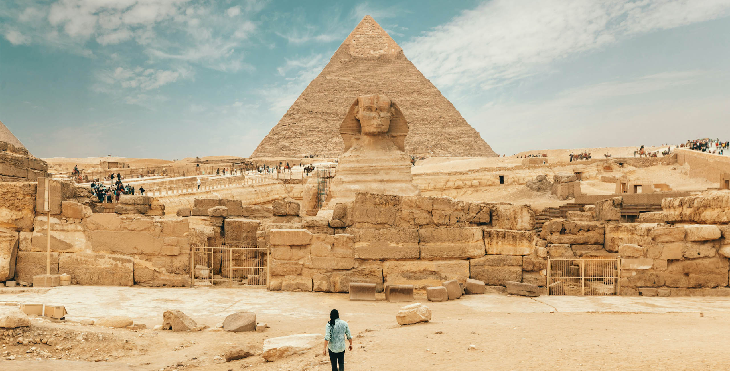 people in front of the sphinx at the pyramid of giza in egypt