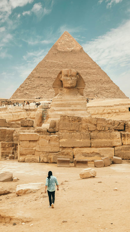 people in front of the sphinx at the pyramid of giza in egypt