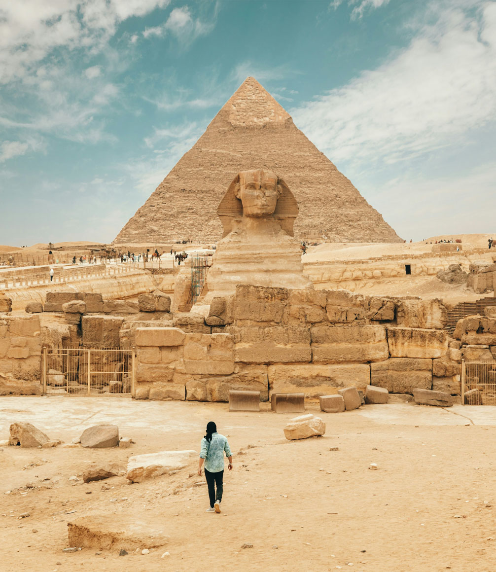 people in front of the sphinx at the pyramid of giza in egypt