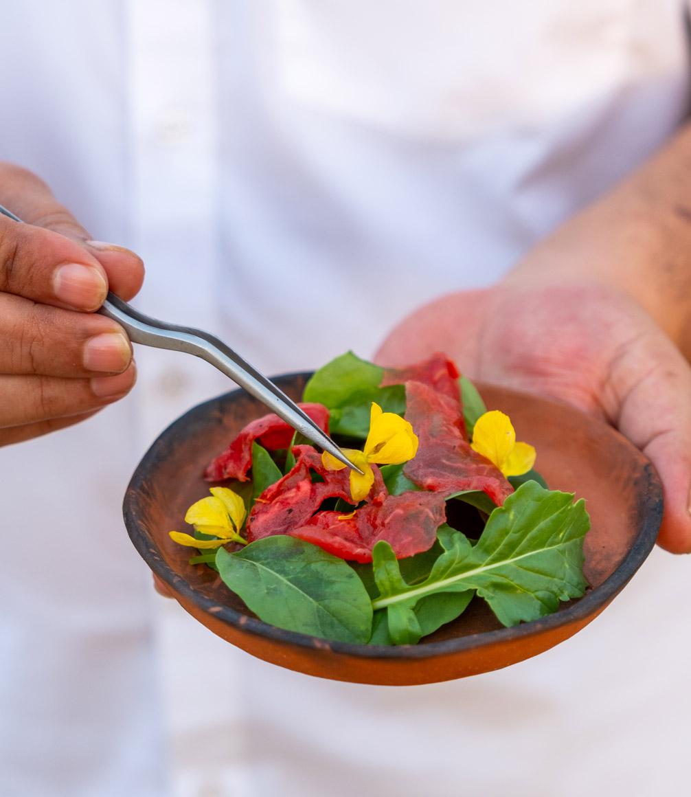 dish of food in clay serving pot at kaner retreat in india