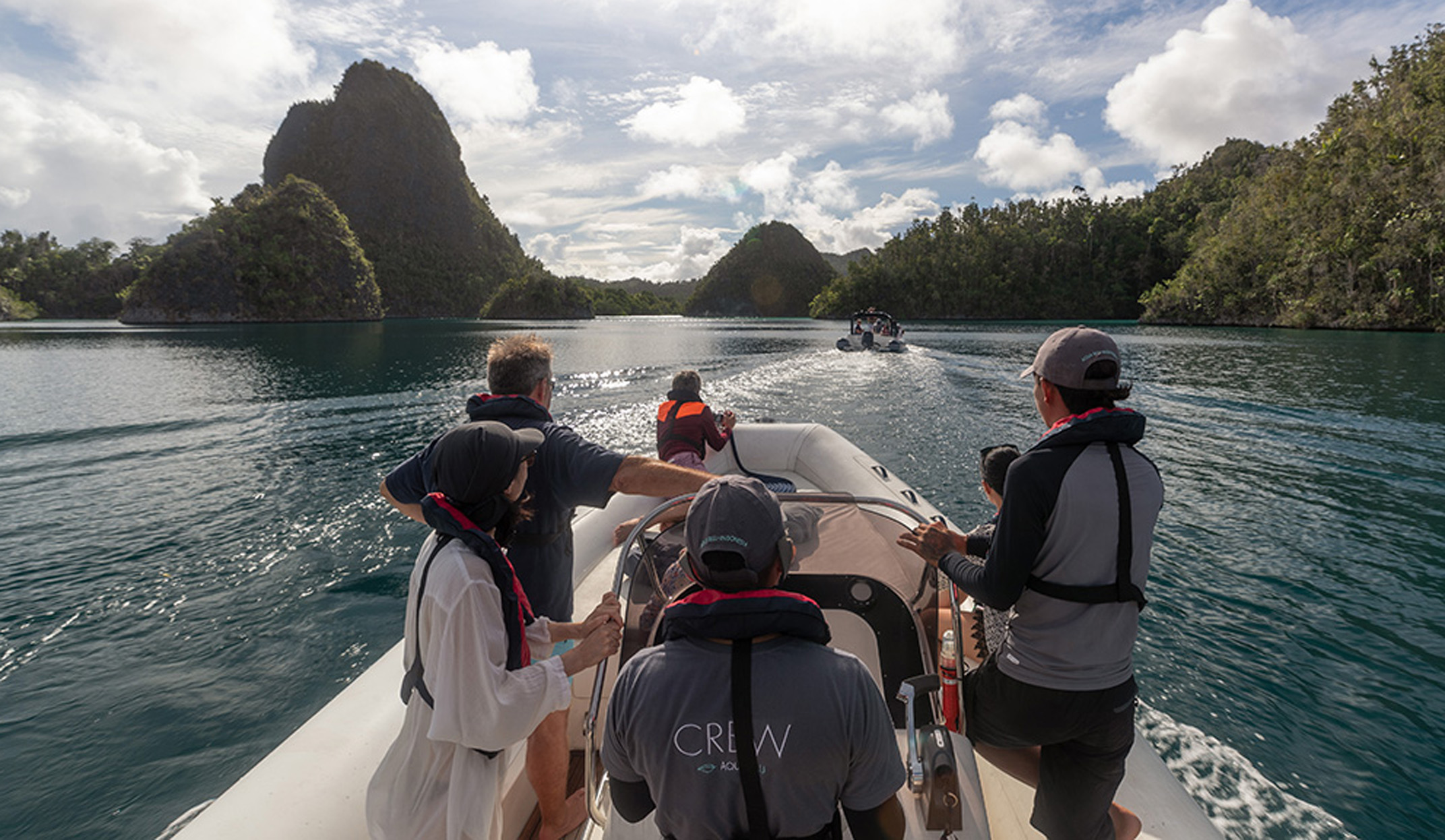 guests on tender tour in raja ampat whilst sailing on the aqua blu yacth