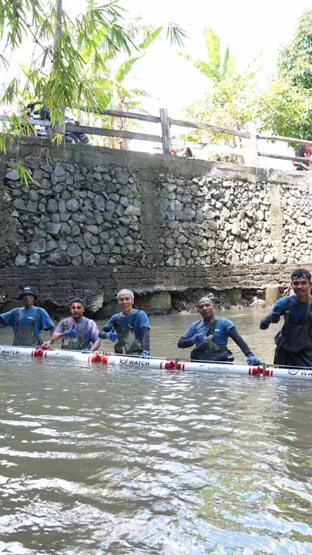 explorations company trash barrier being installed in bali