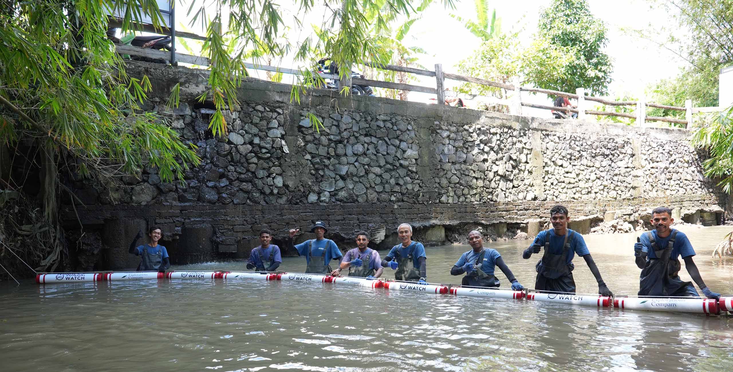 explorations company trash barrier being installed in bali