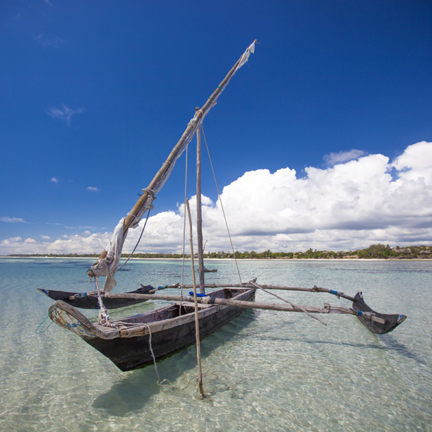 dhow boat on the water at diani beach in kenya