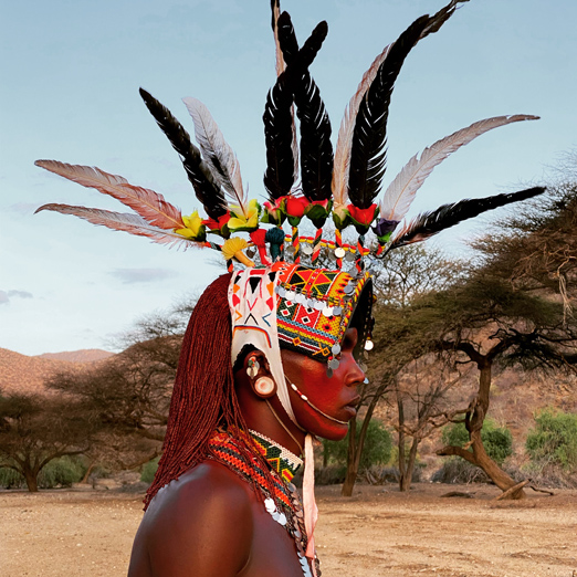 samburu warrior in kenya with feathred headdress