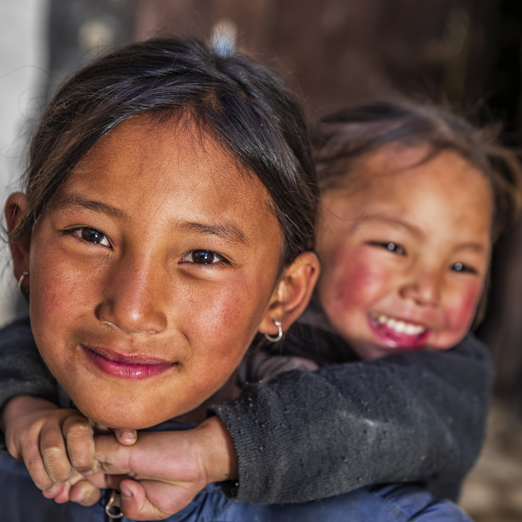 Two Tibetan young girls from Lo Manthang, Upper Mustang. Mustang region is the former Kingdom of Lo and now part of Nepal, in the north-central part of that country, bordering the People's Republic of China on the Tibetan plateau between the Nepalese provinces of Dolpo and Manang.