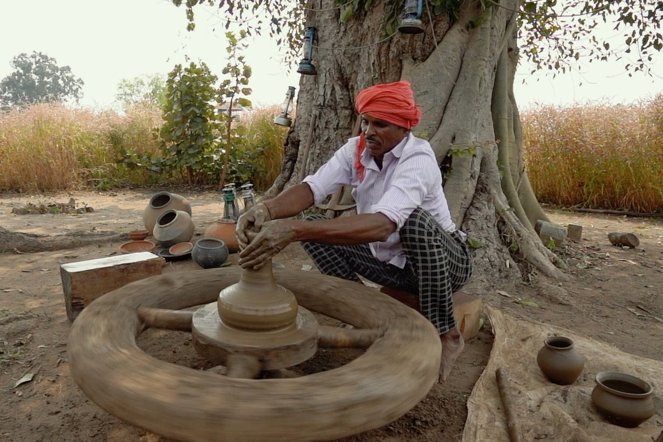local artisan making pottery at haldu tola villa in pench, india