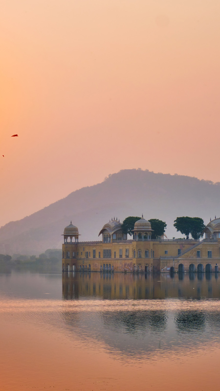 Tranquil morning at Jal Mahal Water Palace at sunrise in Jaipur. Rajasthan, India
